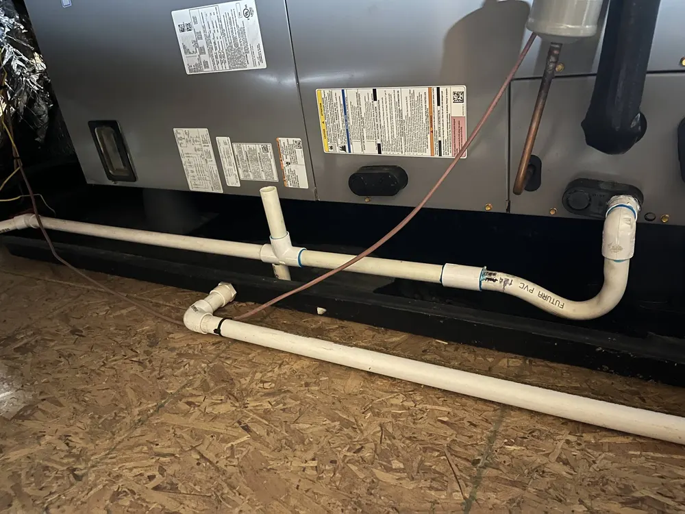 Attic air handler with PVC condensate drain piping